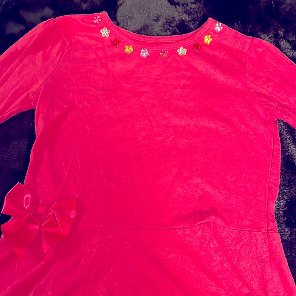 Garanimals used girls long sleeve pink shirt with bow on the bottom.